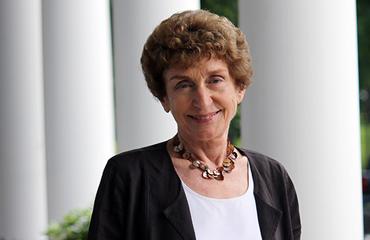 Ruth Mandel standing on the Eagleton Institute porch